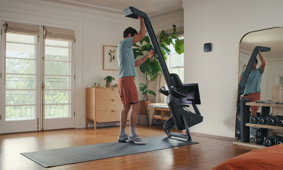 Peloton Row stored upright in a home